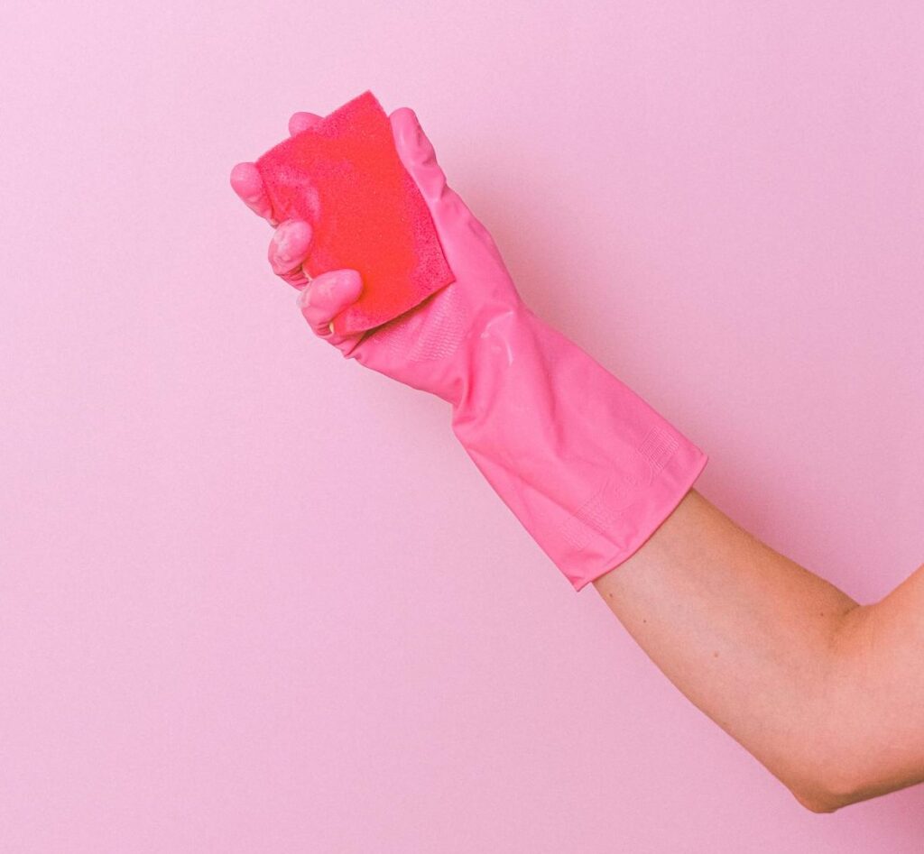 professional cleaner wearing gloves in cleaning